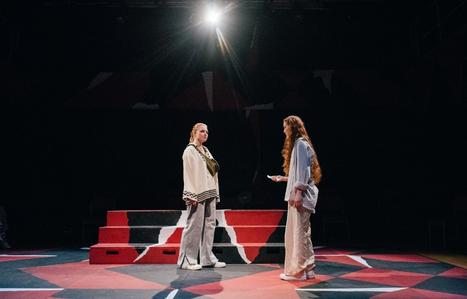 two students on a stage