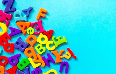 multicoloured alphabet letters on a blue background