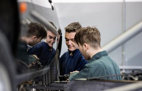 automotive students with car