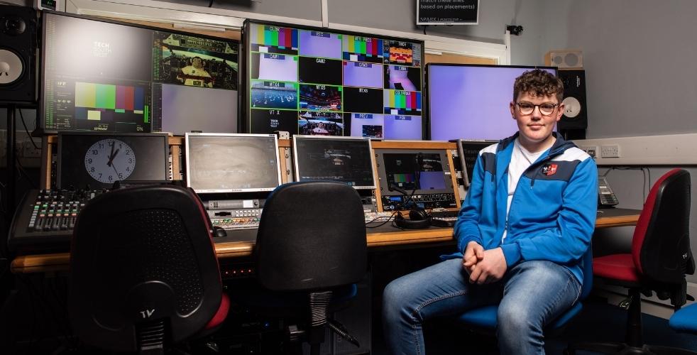 Film student sat in a TV Studio Tech Room