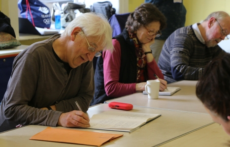 Adults on the Leisure course writing in books