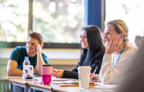 Students in a class smiling