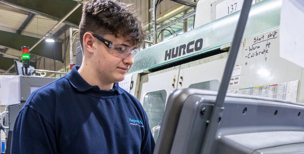 Student at Hepco operating machinery