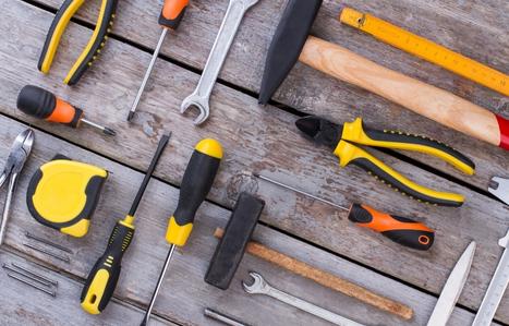 Tools laid out on a wooden background