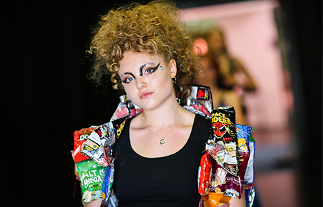 Portrait of student walking in the fashion show