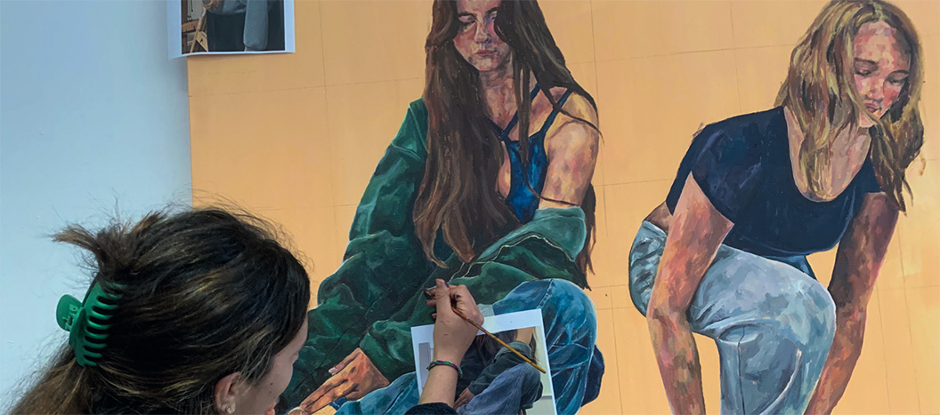 Student making final touches to their painting