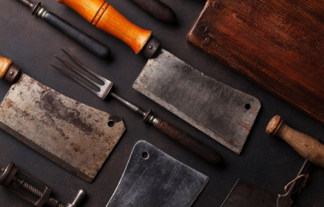 Vintage kitchen utensils on a grey worktop