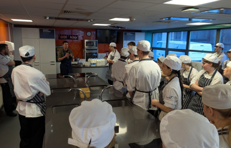 Patrick McGuigan explains to students how to make a basic ricotta cheese