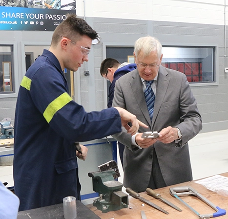 Duke of Gloucester speaking to a male student