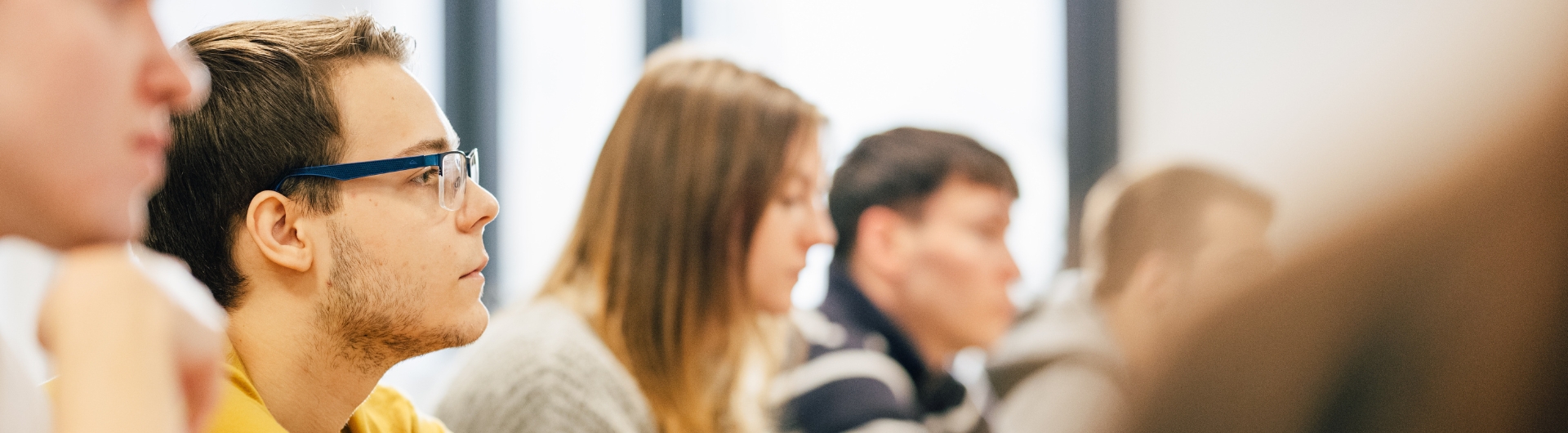 line of students concentrating in a Business class