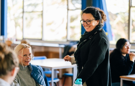 ESOL teacher smiling in class