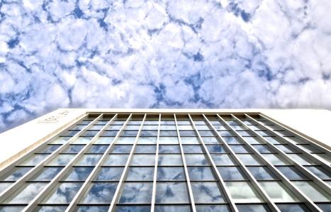clouds and side of a large building