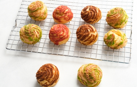 Choux buns on a cooling rack