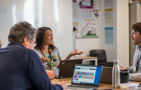 students chatting and smiling in class