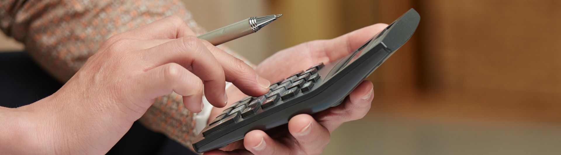 hands on a calculator