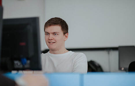 Male Apprenticeships student working on a computer
