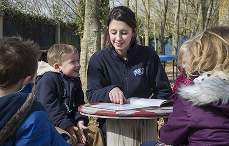 Student working with children in early years