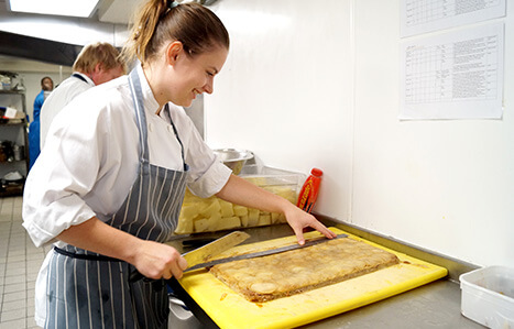 Apprenticeships student working in a kitchen as a chef