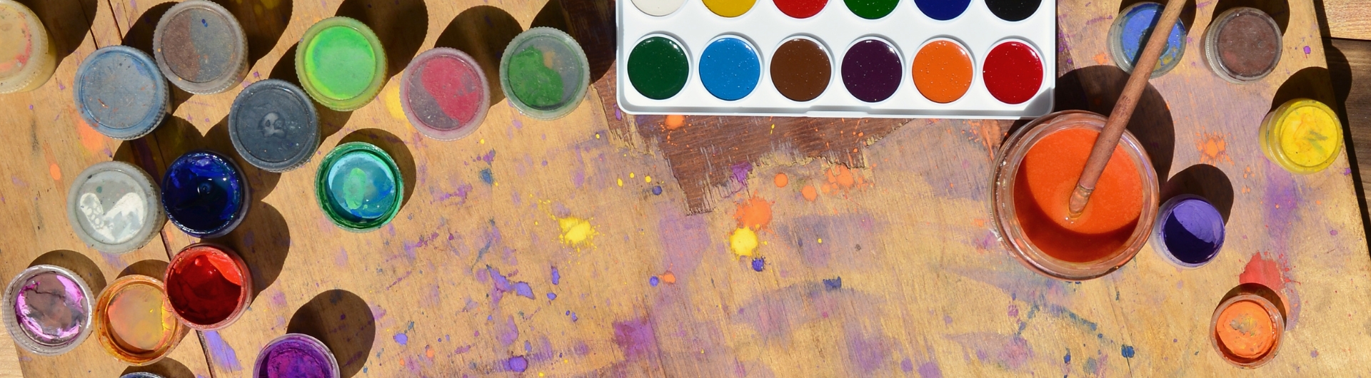 paint pots in an artist's workspace