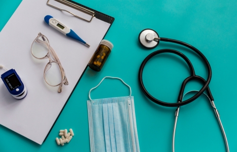 medical items on a teal green background