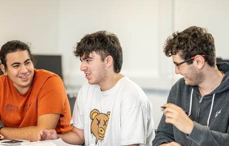 students interacting with each other in class