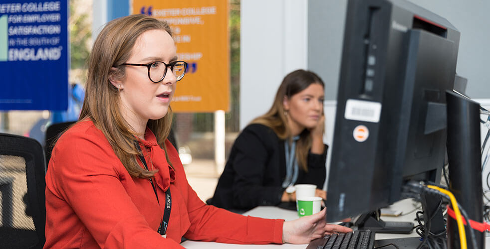 The Apprenticeships team working in the office at their desks