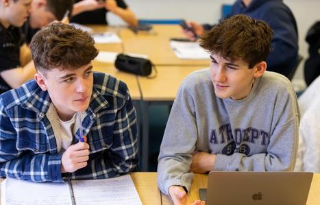 two male students in class
