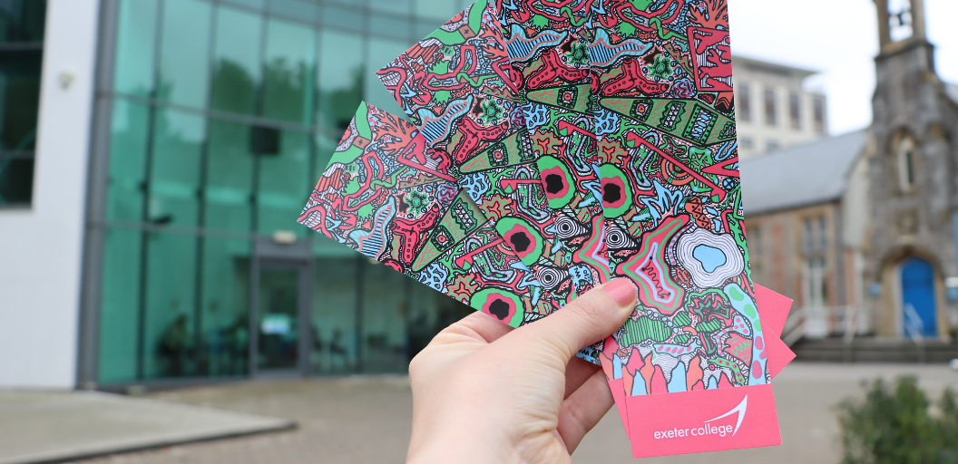 Hand holding colourful bookmarks on World Book Day