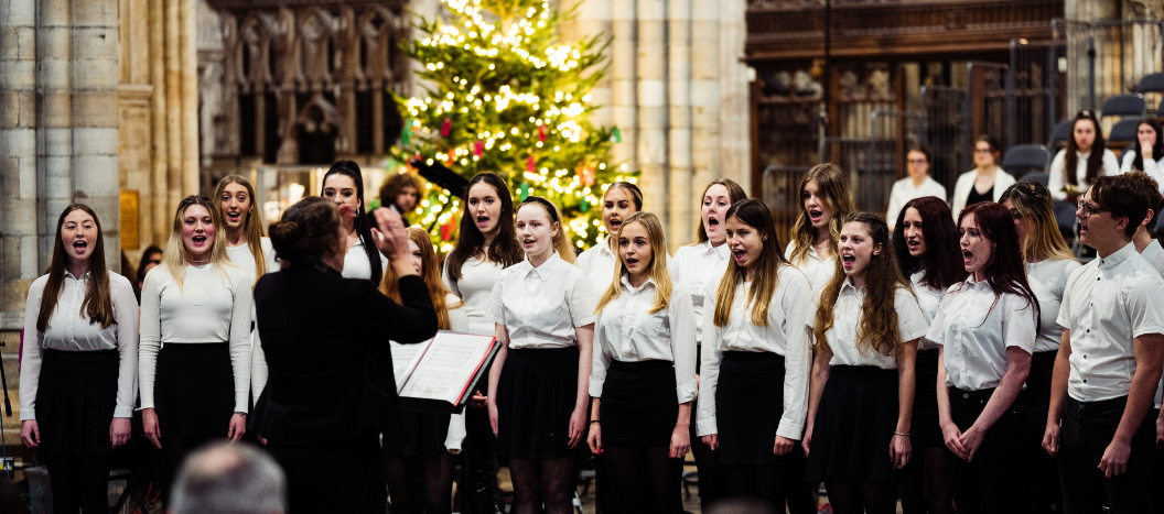 Students singing in the choir at the cathedral