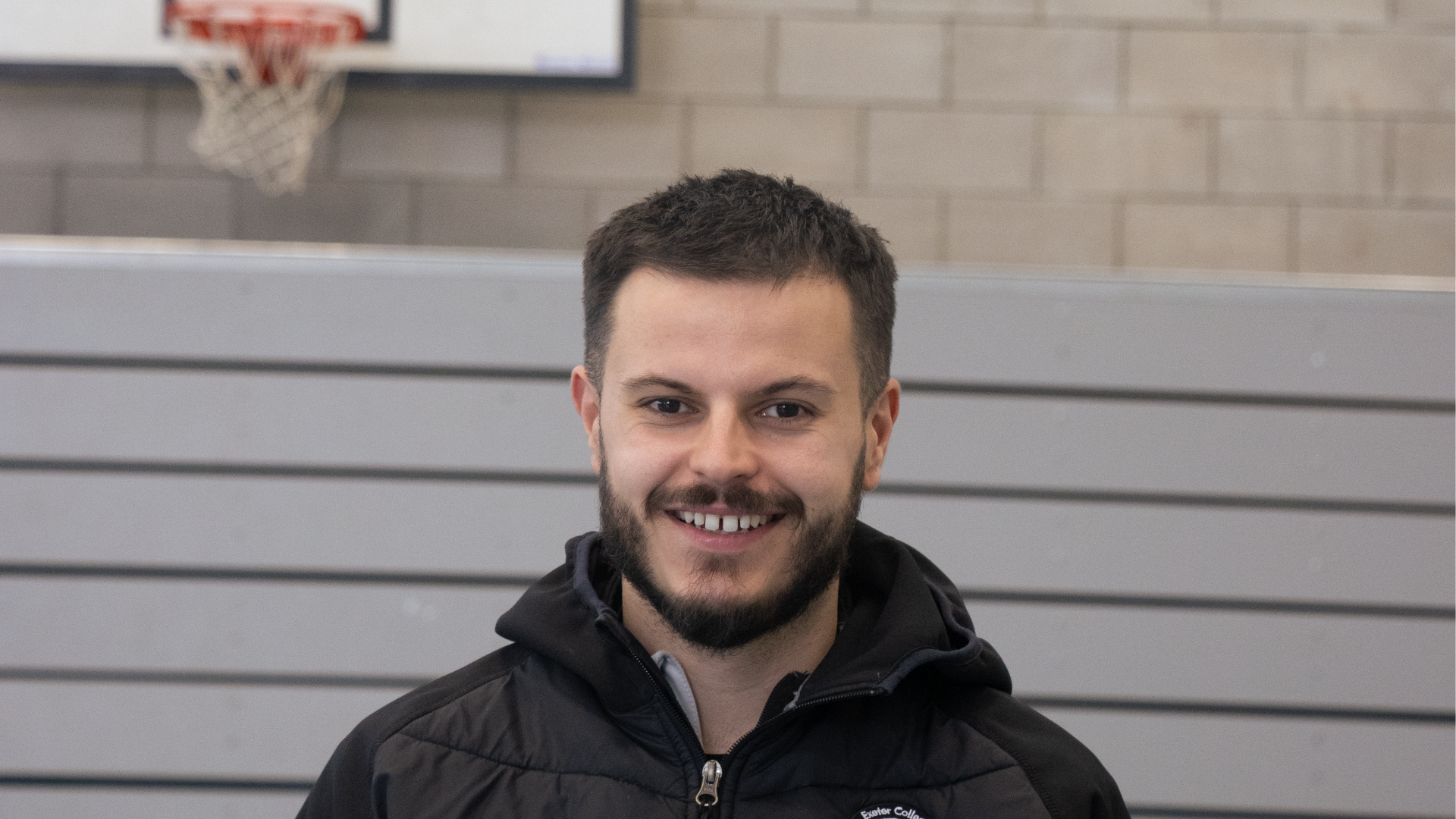 Exeter College sports staff portrait in the sports hall