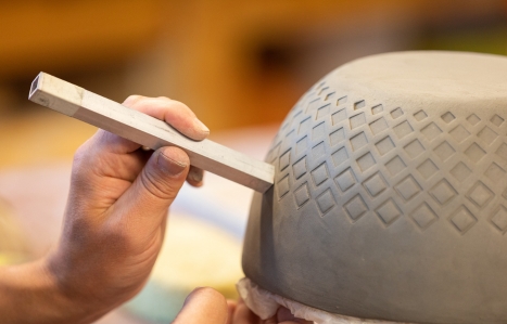 Close up of detailing in clay during a pottery class