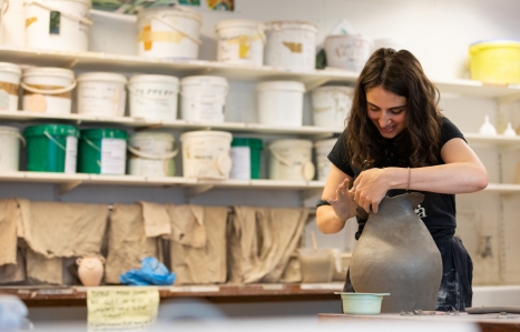 Leisure course student make a pot in pottery course