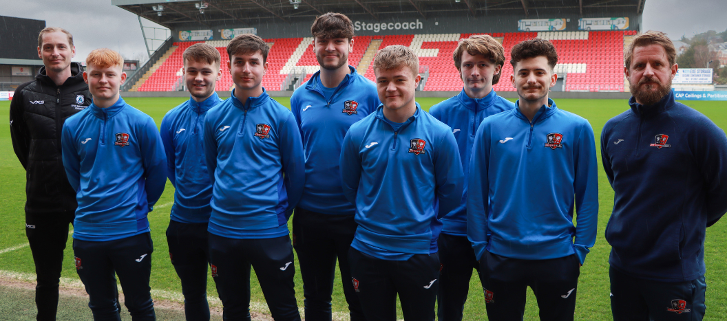 Exeter College Football students and coaches on the sports field at Exeter city