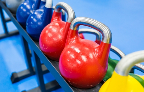 colourful kettlebells in a row