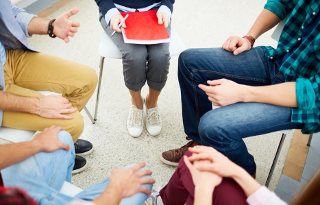 group of people sat in a circle