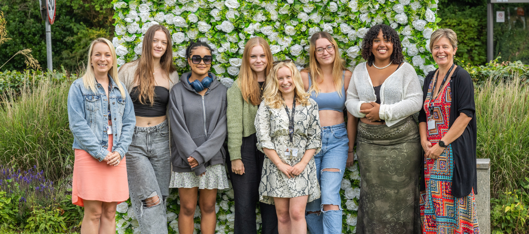 Students smile at the camera