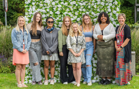 Students smile at the camera