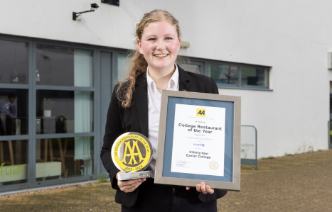 Freya holds up the AA Hospitality Award