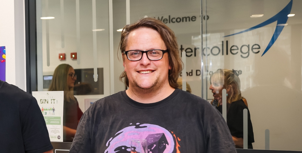 Image of Derek smiling at the camera