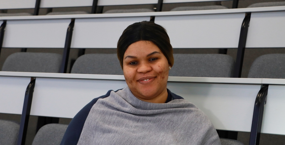 portrait photo of Fanta smiling in a lecture theatre