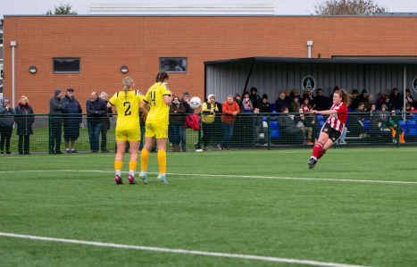 An action shot Connie Pengelly playing football at Exwick Sports Hub.