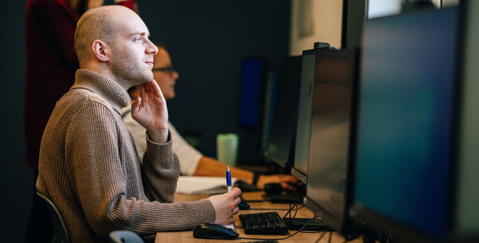 A student looking at a computer screen