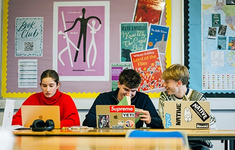 Three students sat in a HLS class