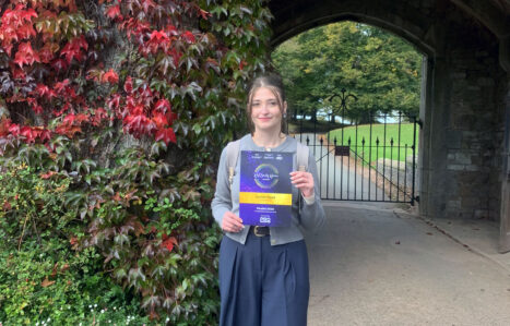 Apprentice holding a certificate