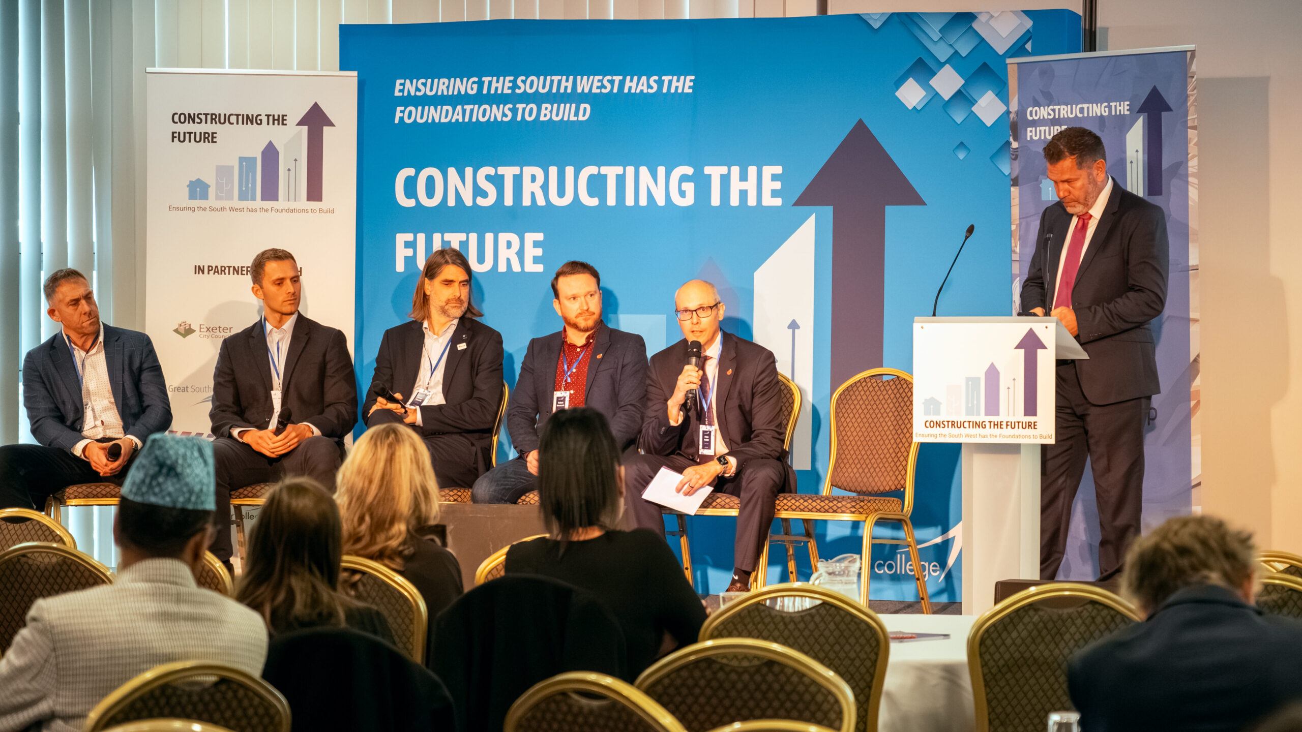 A panel of keynote speakers at an event.