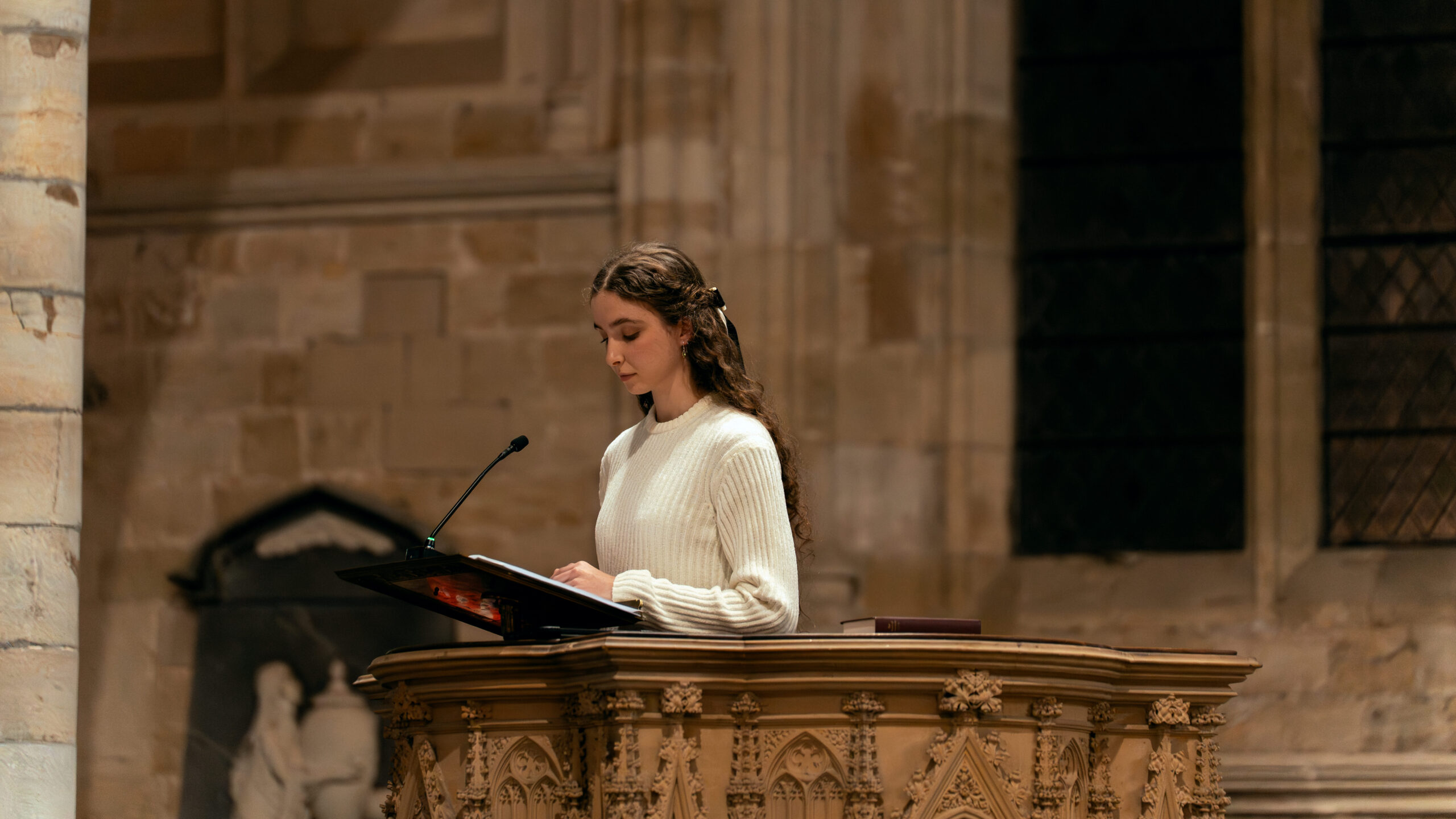Person reading from a pulpit