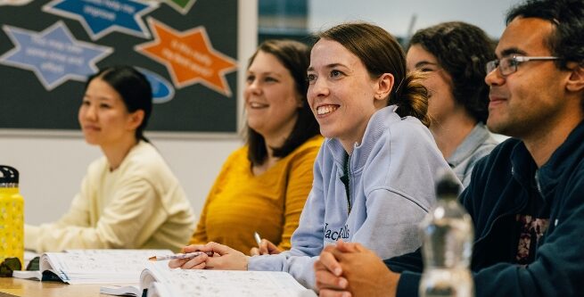 a line of learners smiling in an adult learning leisure course