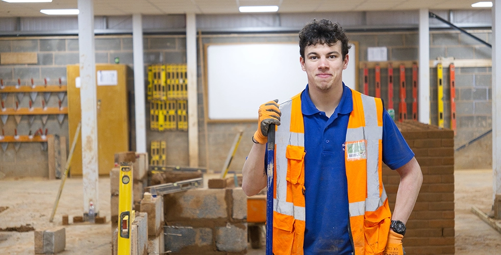 Male Student stood in Construction centre