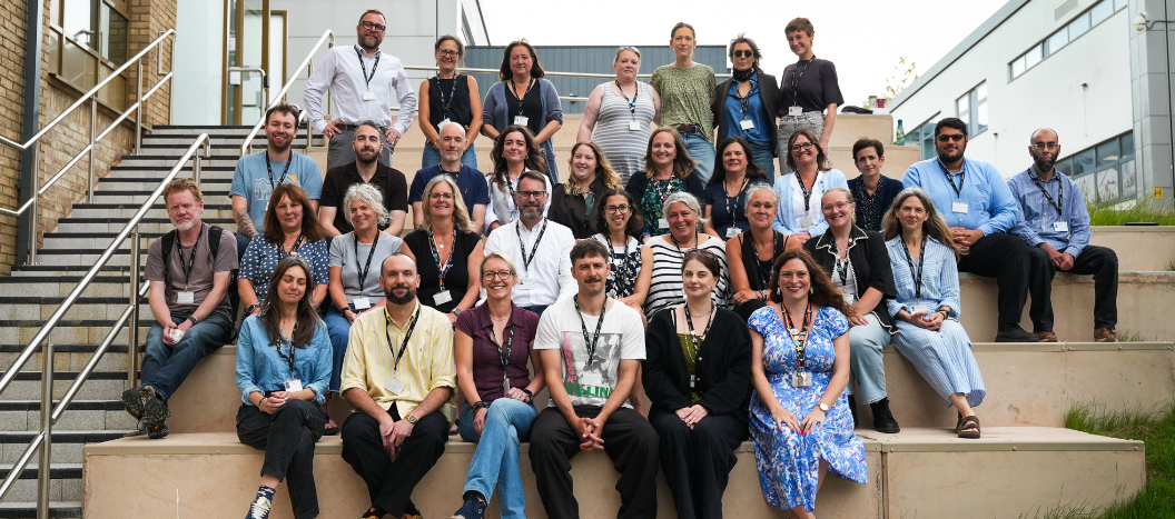 Teachers sat on steps