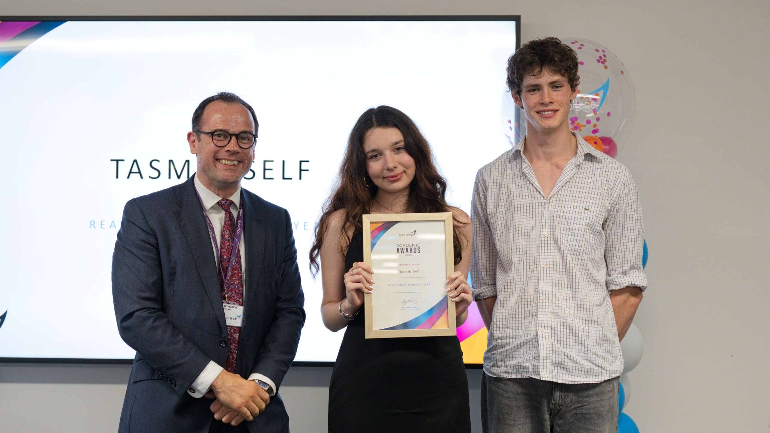 Exeter College's Tasmin Self poses with an award